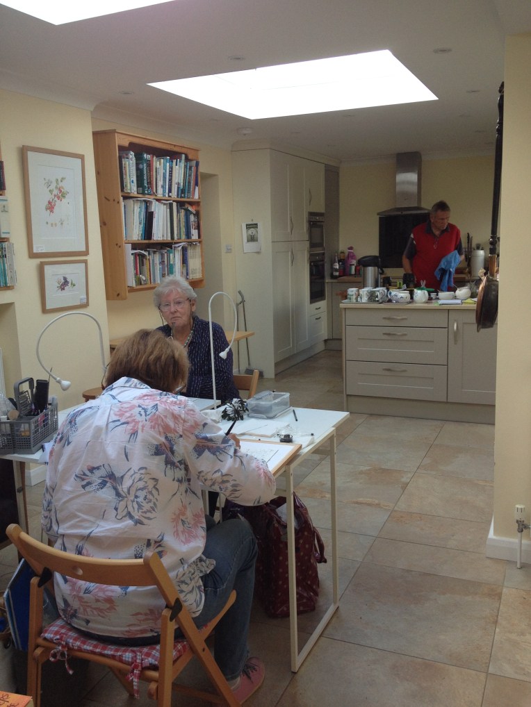 Chief cook and bottle washer in the background